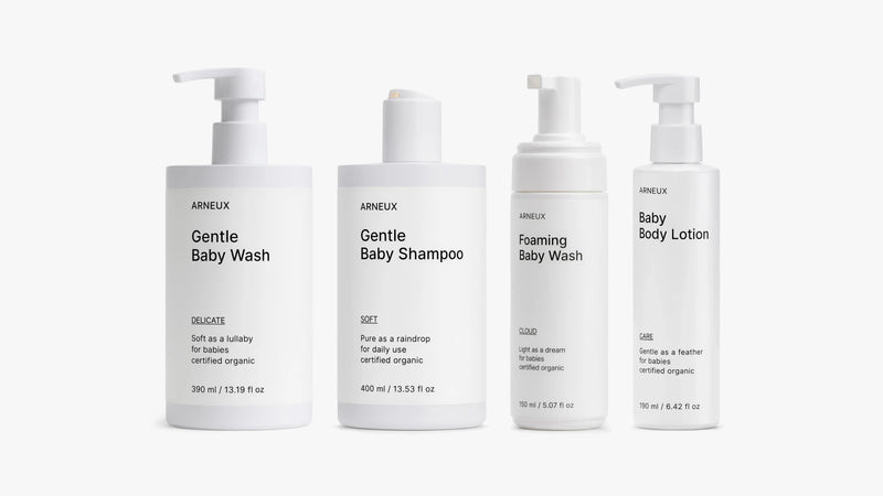 Four bottles of ARNEUX SOFT DELICATE CLOUD and CARE products on a white background