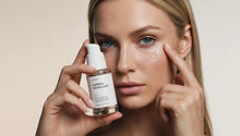 Woman dispensing LIFT caffeine gel booster, clear gel drop rubbing into under eye