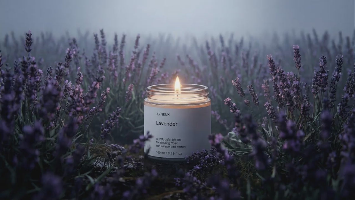 LAVENDER travel candle glowing amid misty purple lavender field, restful herbal floral evening atmosphere