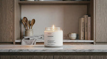 LAVENDER soy wax candle burning on marble kitchen shelf in warm Scandinavian home interior