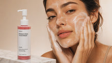 Woman massaging CLEANSE radiant glow facial wash foam across face, gentle no-strip morning cleanse